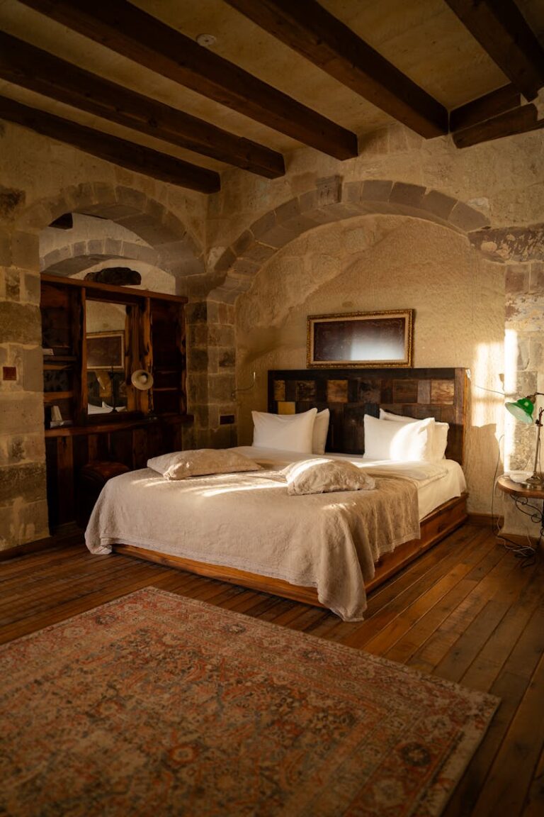 Warm and inviting luxury bedroom with stone walls in Ürgüp, Türkiye.